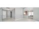Open living room with neutral walls and tile flooring at 17113 Se 78Th Larchmont Ct, The Villages, FL 32162