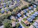 Expansive aerial view of a charming neighborhood highlighting the home's location on a corner lot at 17242 Se 94Th Coults Cir, The Villages, FL 32162