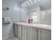 Bathroom with double vanity and a mirror at 17242 Se 94Th Coults Cir, The Villages, FL 32162