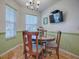 Bright dining area with round table and four chairs at 17242 Se 94Th Coults Cir, The Villages, FL 32162
