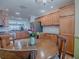 Bright kitchen with stainless steel appliances and wood cabinets at 17242 Se 94Th Coults Cir, The Villages, FL 32162