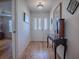 Open-concept kitchen and living space featuring a breakfast bar and a sunroom with lots of natural light at 17242 Se 94Th Coults Cir, The Villages, FL 32162