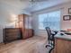 Home office with wood furniture and a large window at 17242 Se 94Th Coults Cir, The Villages, FL 32162
