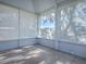 Bright screened porch with tiled flooring and views of trees at 17242 Se 94Th Coults Cir, The Villages, FL 32162
