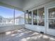 Screened porch with tiled floors and view of the backyard at 17242 Se 94Th Coults Cir, The Villages, FL 32162