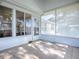 Screened porch with tiled floor and access to the backyard at 17242 Se 94Th Coults Cir, The Villages, FL 32162