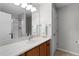 Bathroom with wood vanity and granite countertop at 17466 Se 75Th Coachman Ct, The Villages, FL 32162