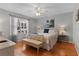 Main bedroom with hardwood floors and calming decor at 17466 Se 75Th Coachman Ct, The Villages, FL 32162