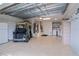 Spacious garage with golf cart, washer, dryer, and extra storage at 17466 Se 75Th Coachman Ct, The Villages, FL 32162