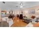 Living room with hardwood floors and dining area view at 17466 Se 75Th Coachman Ct, The Villages, FL 32162
