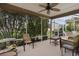 Relaxing screened porch with patio furniture at 17466 Se 75Th Coachman Ct, The Villages, FL 32162
