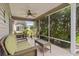 Relaxing screened porch with wicker furniture and ceiling fan at 17466 Se 75Th Coachman Ct, The Villages, FL 32162