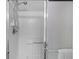 Clean shower with glass enclosure and handheld shower head at 17466 Se 75Th Coachman Ct, The Villages, FL 32162