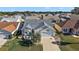 Single-Gathering home with a two-car garage and nicely landscaped yard in a residential neighborhood at 1757 Landrum Ln, The Villages, FL 32162