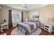 Guest bedroom with wood floors and ceiling fan at 1757 Landrum Ln, The Villages, FL 32162