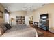 Spacious bedroom with wood floors and ceiling fan at 1757 Landrum Ln, The Villages, FL 32162