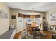 Cozy breakfast nook with built-in bench seating and wood table at 1757 Landrum Ln, The Villages, FL 32162
