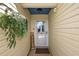 Inviting entryway with a welcome sign and hanging plant at 1757 Landrum Ln, The Villages, FL 32162
