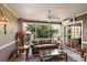 Bright sunroom with comfy seating and lots of windows at 1757 Landrum Ln, The Villages, FL 32162