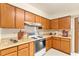 Traditional kitchen offering light countertops and wooden cabinets, complete with modern appliances at 1801 Vine St, Leesburg, FL 34748