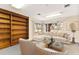Comfortable living room featuring stylish furnishings and a built-in bookshelf, bathed in lots of natural light at 1801 Vine St, Leesburg, FL 34748