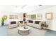 Cozy living room with lots of light, featuring modern furnishings and a decorative rug at 1801 Vine St, Leesburg, FL 34748