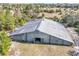 Aerial view of a long metal barn with large doors at 26650 Pelican St, Eustis, FL 32736