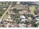 Aerial view of a home, barn and surrounding land at 26650 Pelican St, Eustis, FL 32736