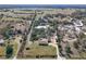 Aerial view of a house and large lot with other buildings at 26650 Pelican St, Eustis, FL 32736
