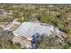 Aerial view showing a large metal building on a wooded lot at 26650 Pelican St, Eustis, FL 32736
