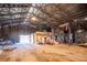 Open barn interior with high ceilings and various equipment at 26650 Pelican St, Eustis, FL 32736