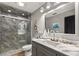 Bathroom features a walk-in shower and marble vanity at 26650 Pelican St, Eustis, FL 32736