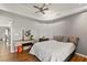 Bedroom with desk, ceiling fan and hardwood floors at 26650 Pelican St, Eustis, FL 32736