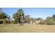 Property entrance with wrought-iron gate and open landscape at 26650 Pelican St, Eustis, FL 32736