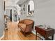 Light and bright hallway with wood floors and decorative accents at 26650 Pelican St, Eustis, FL 32736