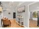 Hallway featuring wood floors, a bench, and decorative elements at 26650 Pelican St, Eustis, FL 32736