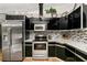 Updated kitchen with stainless steel appliances and granite countertops at 26650 Pelican St, Eustis, FL 32736
