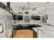 Sleek kitchen boasting granite counters and black cabinetry at 26650 Pelican St, Eustis, FL 32736
