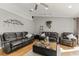 Spacious living room with comfortable leather sofas and coffee table at 26650 Pelican St, Eustis, FL 32736