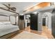 Main bedroom showcasing a barn door separating it from the kitchen and bathroom at 26650 Pelican St, Eustis, FL 32736