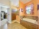 Bathroom with large walk-in shower and access to the closet at 27103 Camerons Run, Leesburg, FL 34748