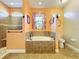 Bathroom with soaking tub, walk-in shower, and toilet at 27103 Camerons Run, Leesburg, FL 34748