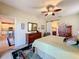 Spacious bedroom with ensuite bathroom access and kitchen views at 27103 Camerons Run, Leesburg, FL 34748