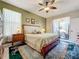 Bright bedroom with garden access and built-in storage at 27103 Camerons Run, Leesburg, FL 34748