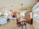 Bright breakfast nook with built in hutch and view into the kitchen at 27103 Camerons Run, Leesburg, FL 34748