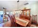 Spacious dining room with a large wooden table and hutch at 27103 Camerons Run, Leesburg, FL 34748