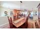 Open concept dining room with a view of the kitchen and living areas at 27103 Camerons Run, Leesburg, FL 34748