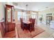 Spacious dining room featuring a large wooden table and hutch at 27103 Camerons Run, Leesburg, FL 34748
