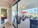 Enclosed patio with seating area and outdoor dining at 27103 Camerons Run, Leesburg, FL 34748