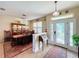 Elegant entryway with a stained-glass door and views of the dining room at 27103 Camerons Run, Leesburg, FL 34748